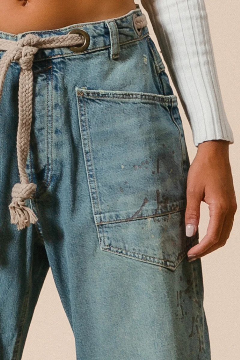 Close up of jeans front pocket with rope belt